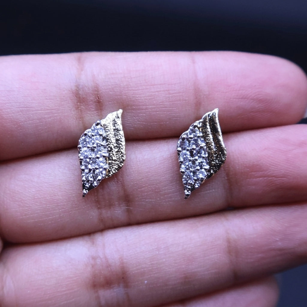 Golden studs with zircon
