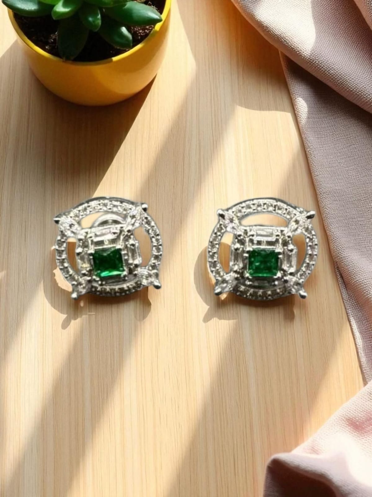 Stylish zircon studs with emerald