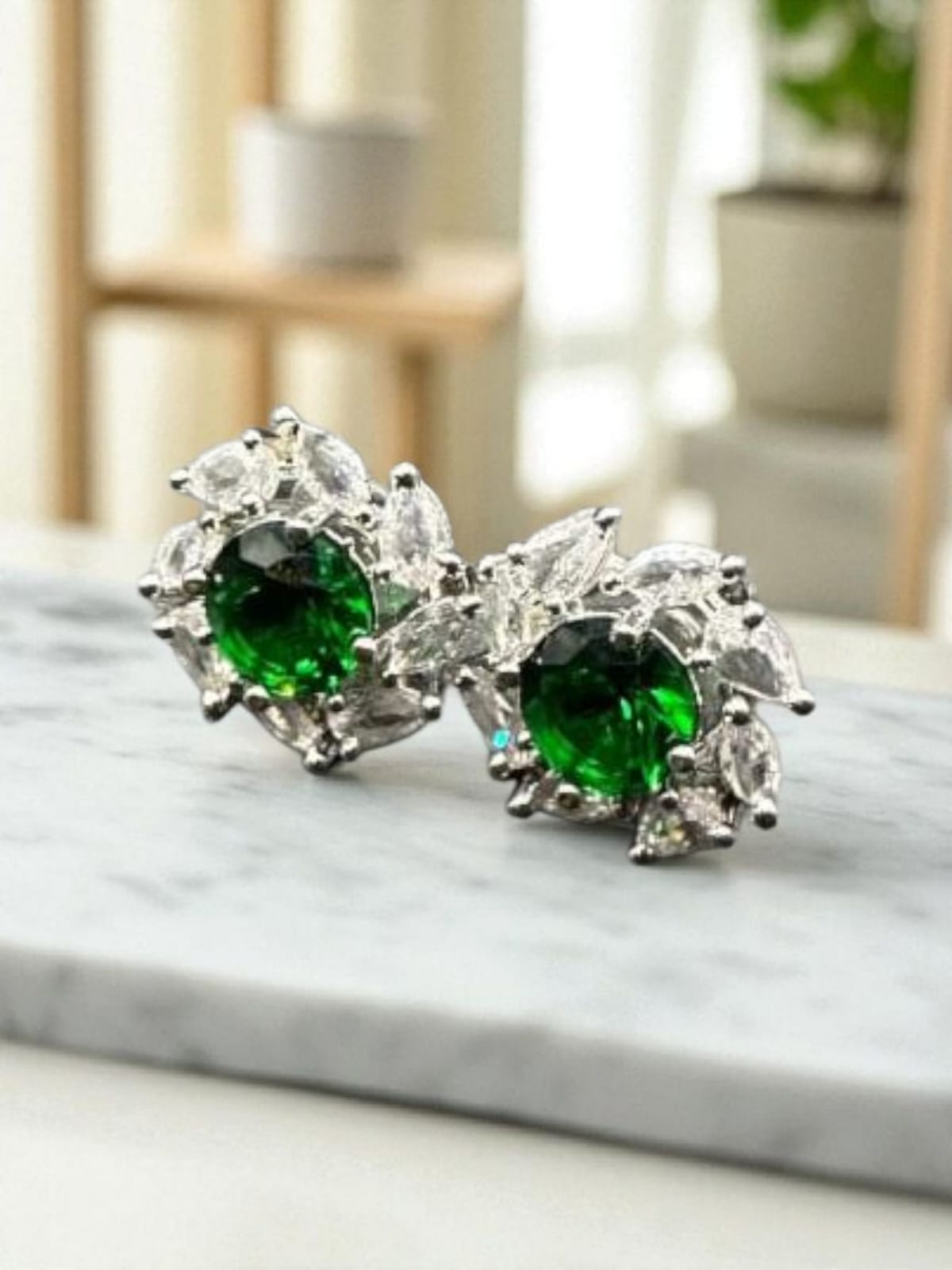 Diamond cut zircon studs with emerald inside
