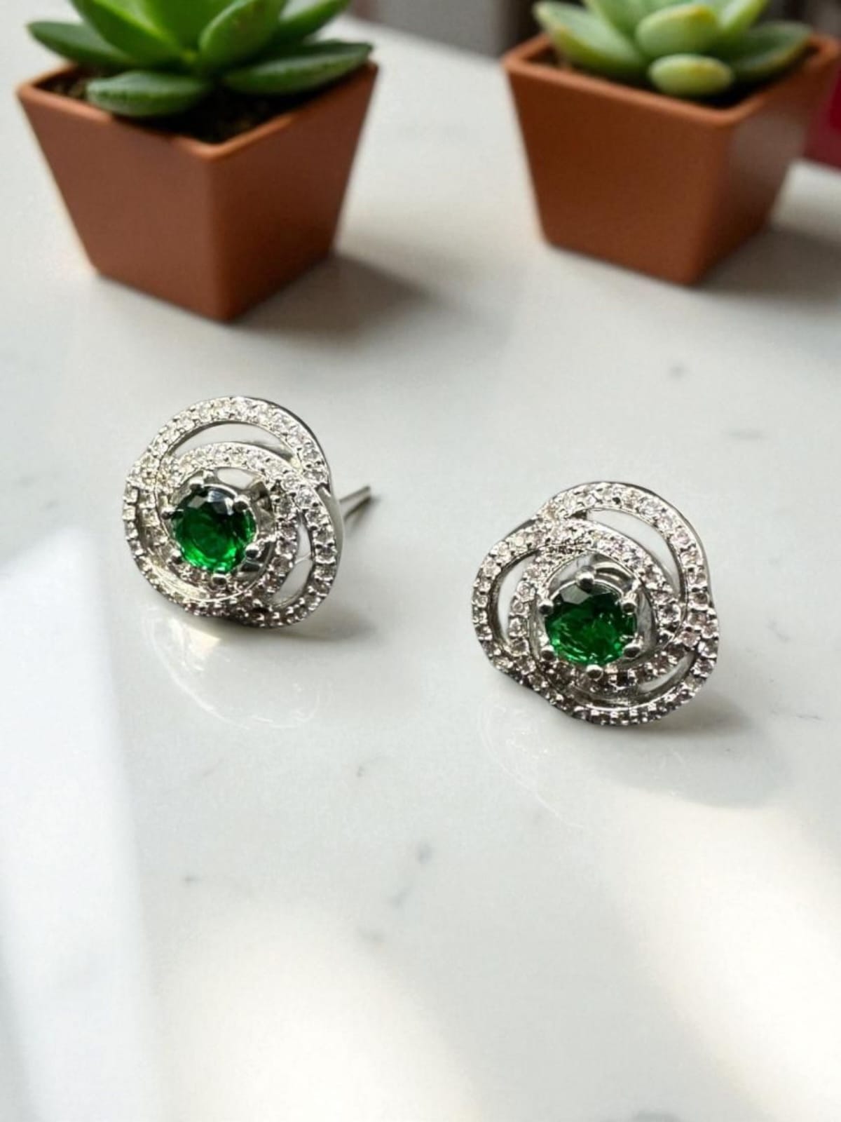 Classic zircon studs with emerald inside