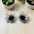 Diamond cut zircon studs with sapphire inside