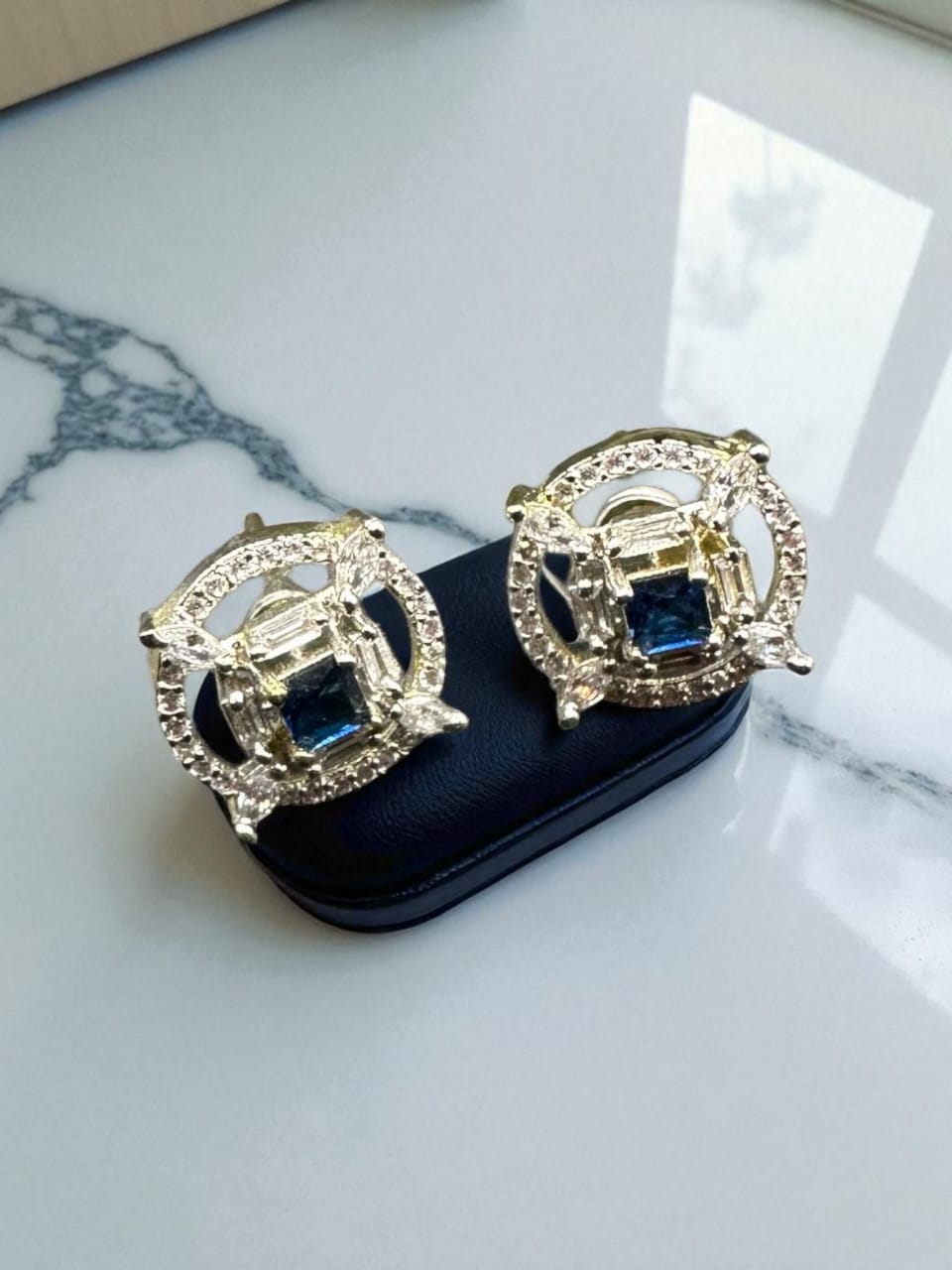 Stylish zircon studs with sapphire