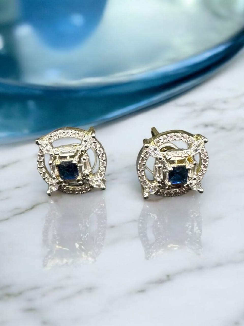 Stylish zircon studs with sapphire