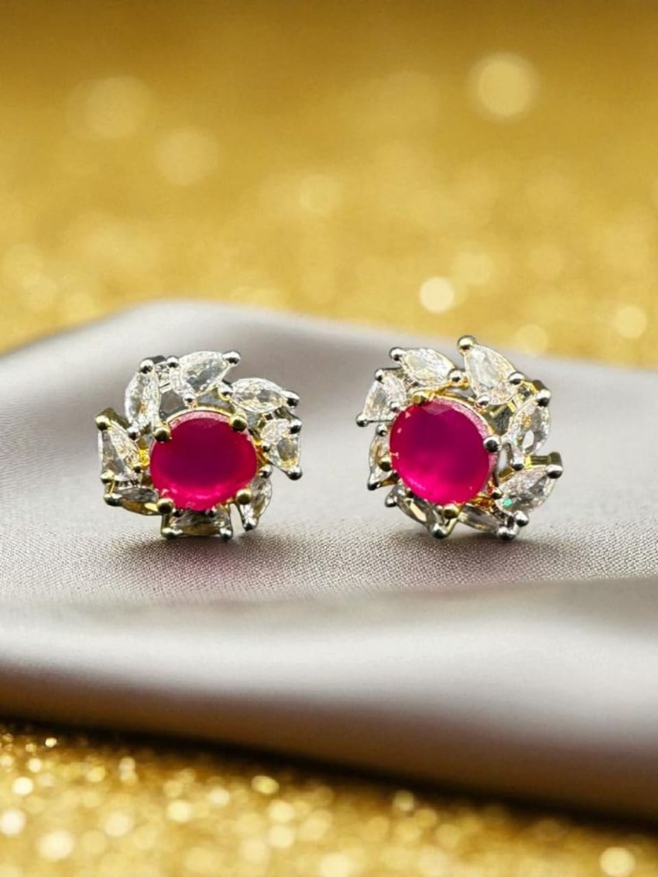 Zircon studs with ruby in gold base