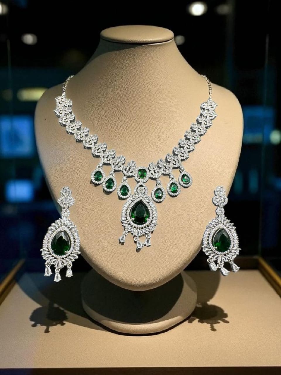 Silver plated zircon set with emerald