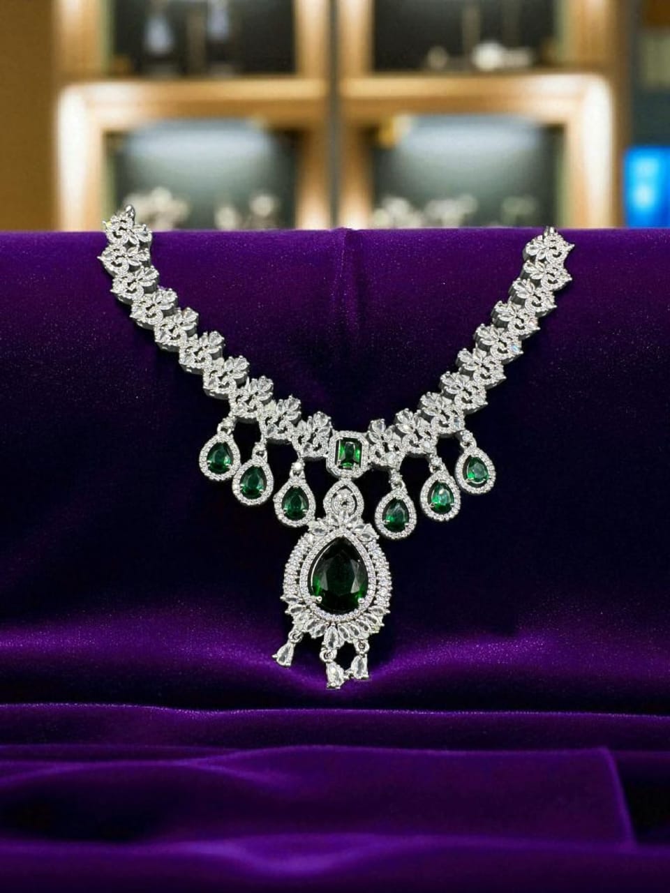 Silver plated zircon set with emerald