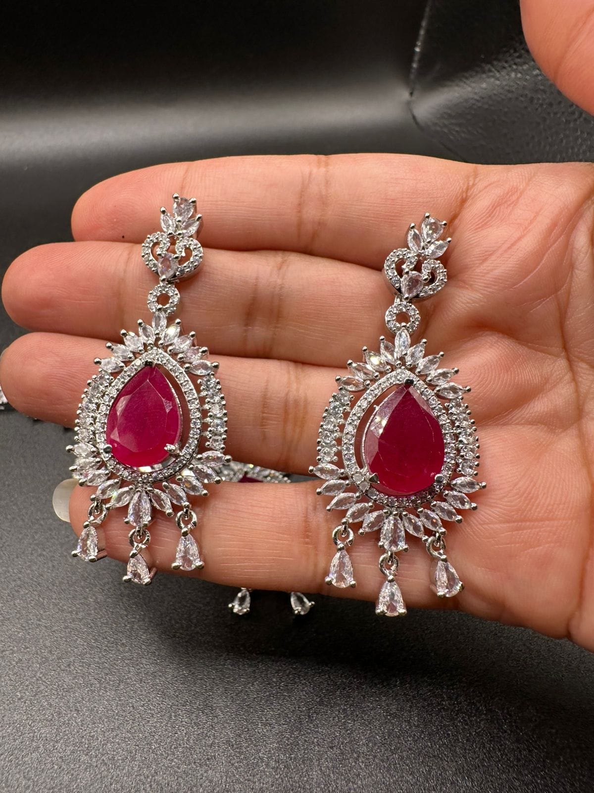Silver plated zircon set with ruby
