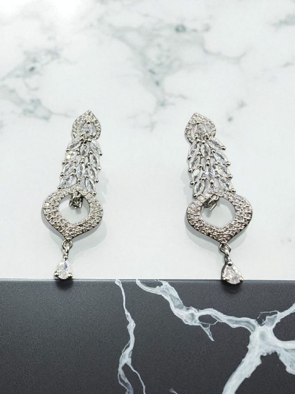 Silver earrings with zircon