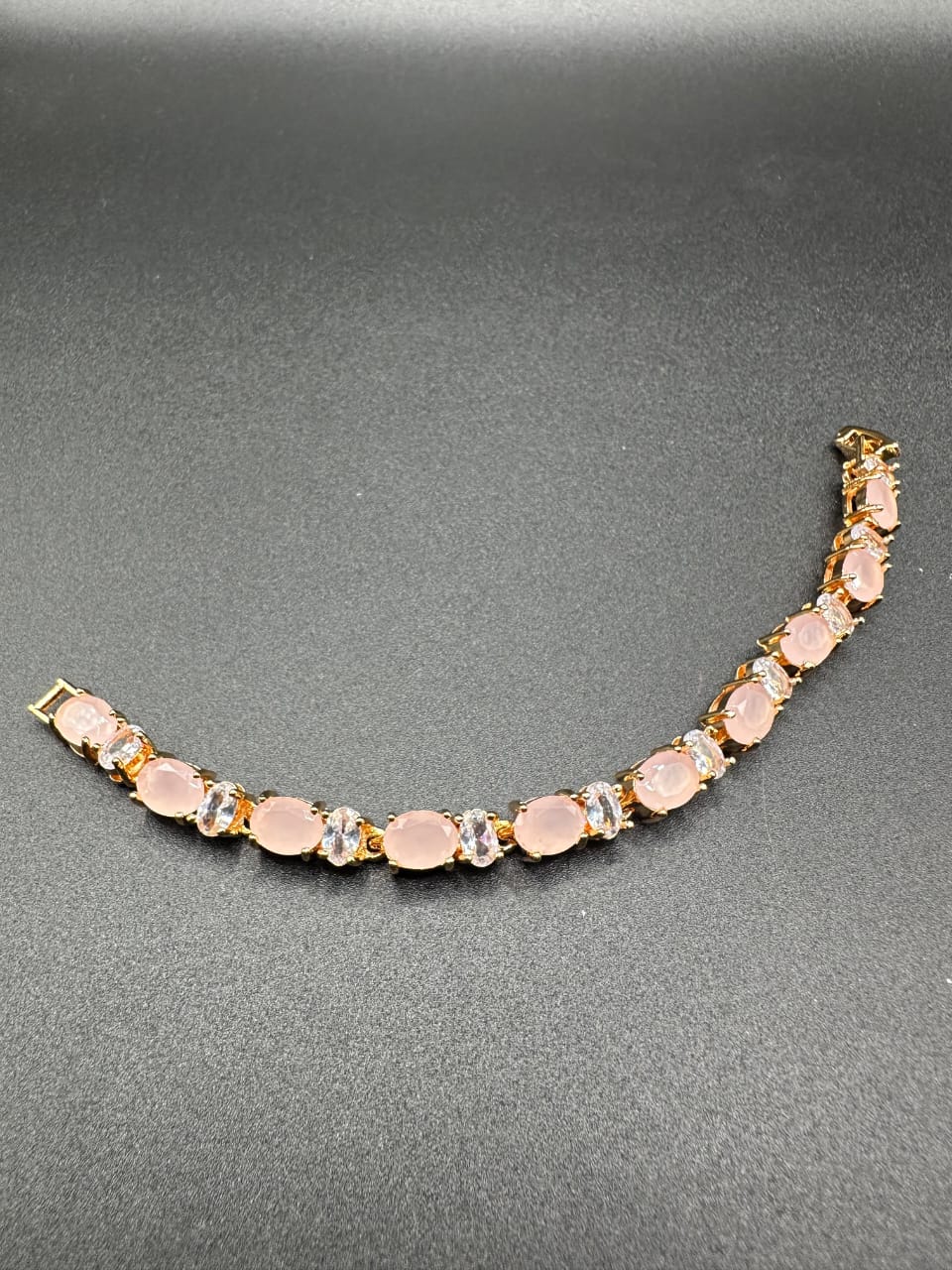 Pink tone bracelet with golden base for girls