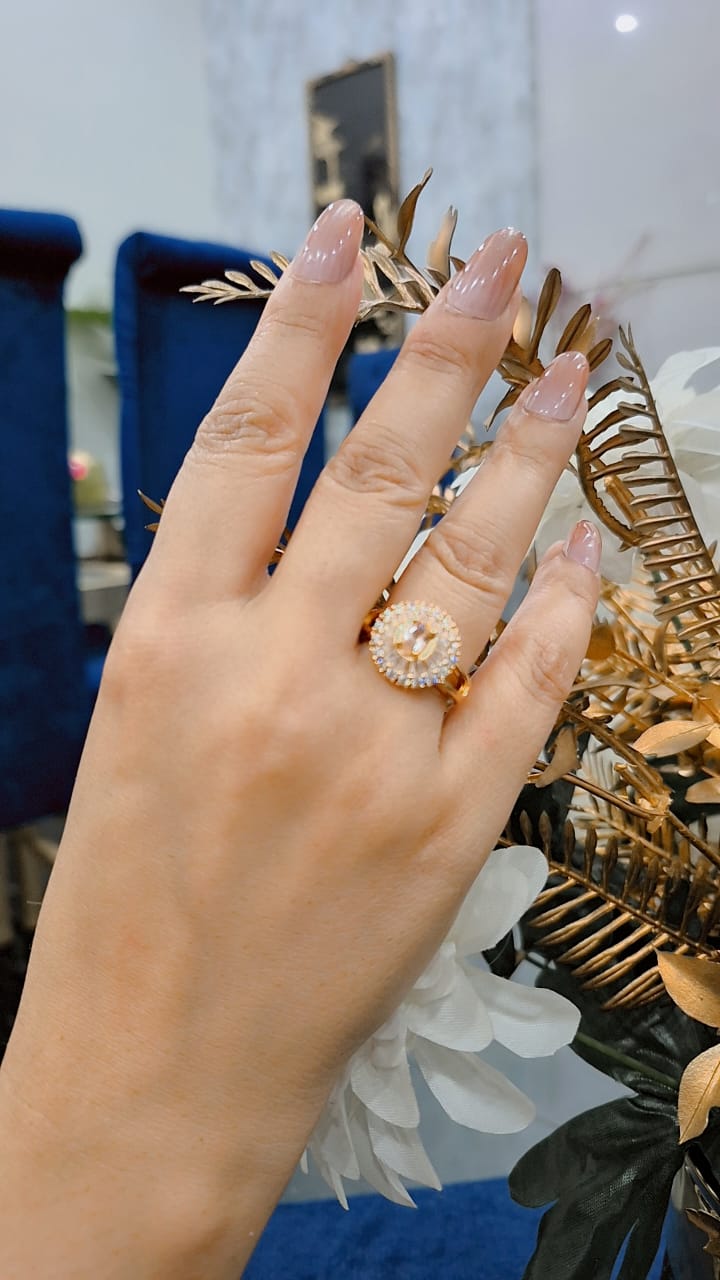 Golden ring with champagne stones