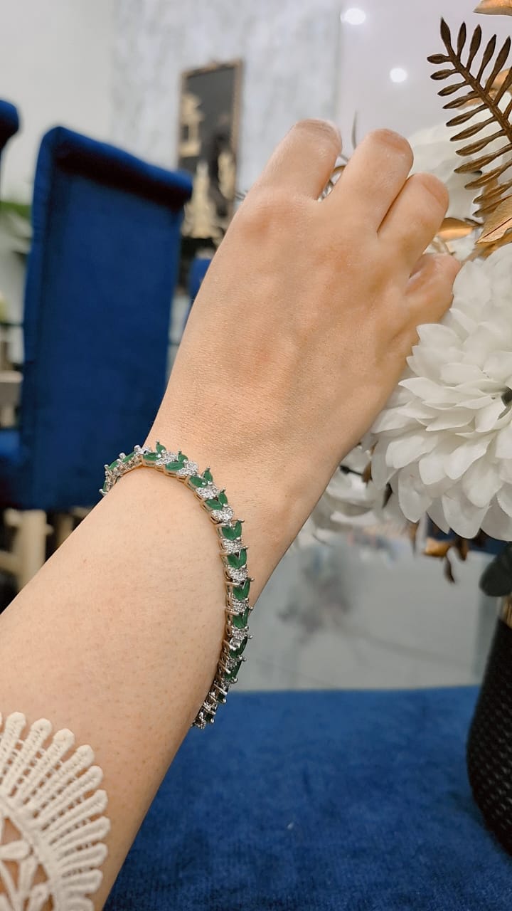 Emerald and zircon bracelet with silver base