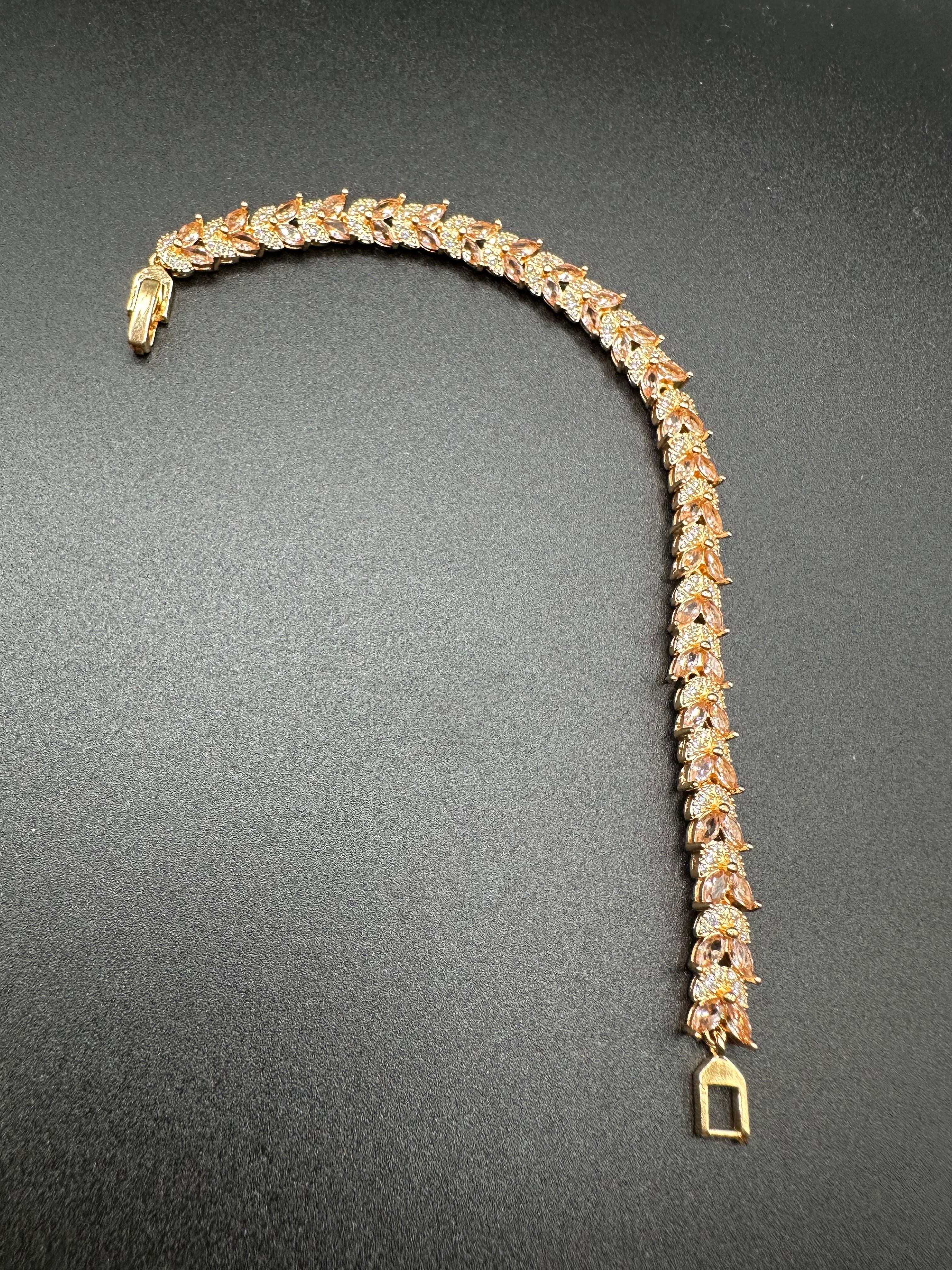 Zircon and champagne stones bracelet with golden base