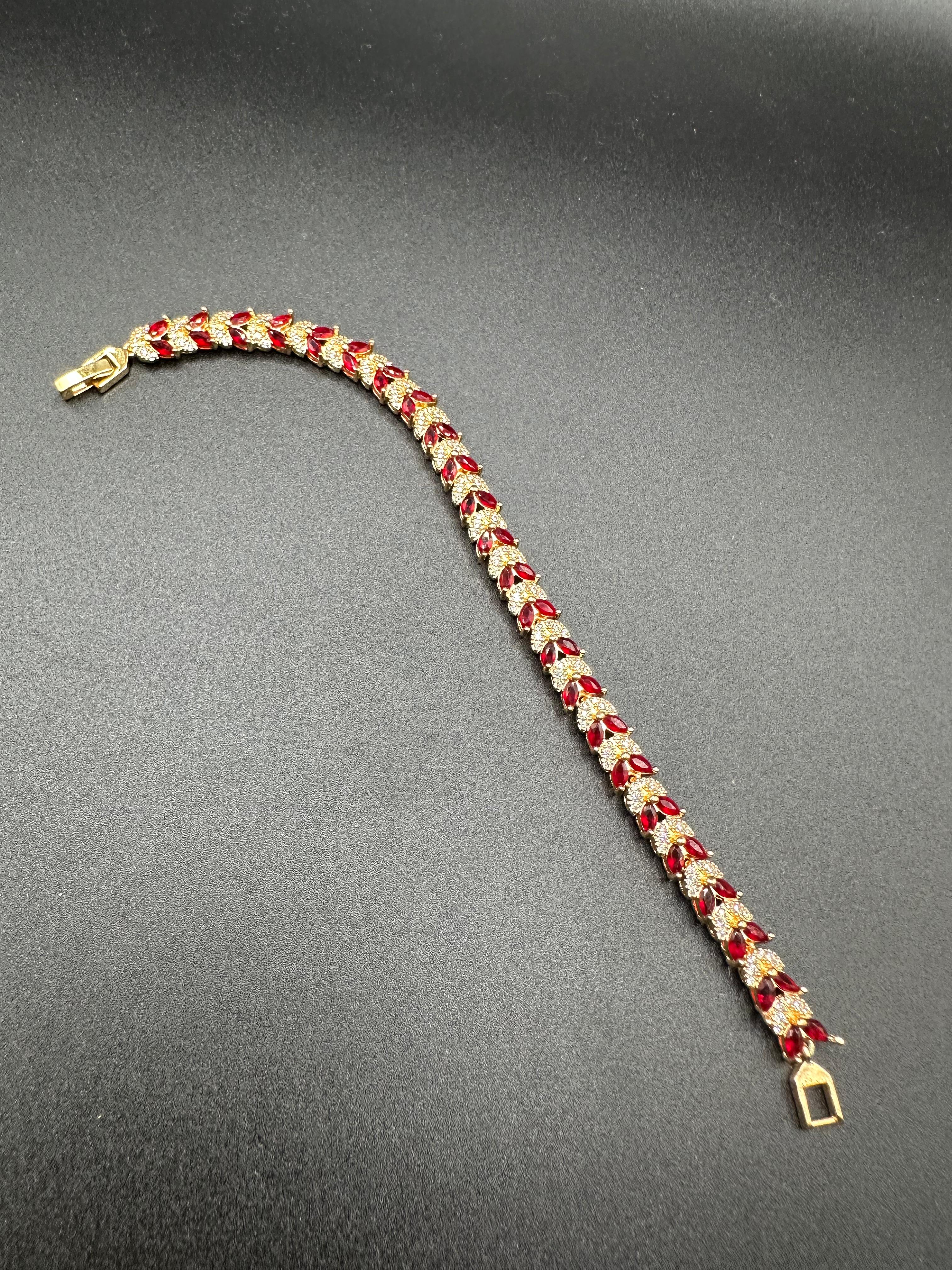 Ruby and zircon bracelet with golden base
