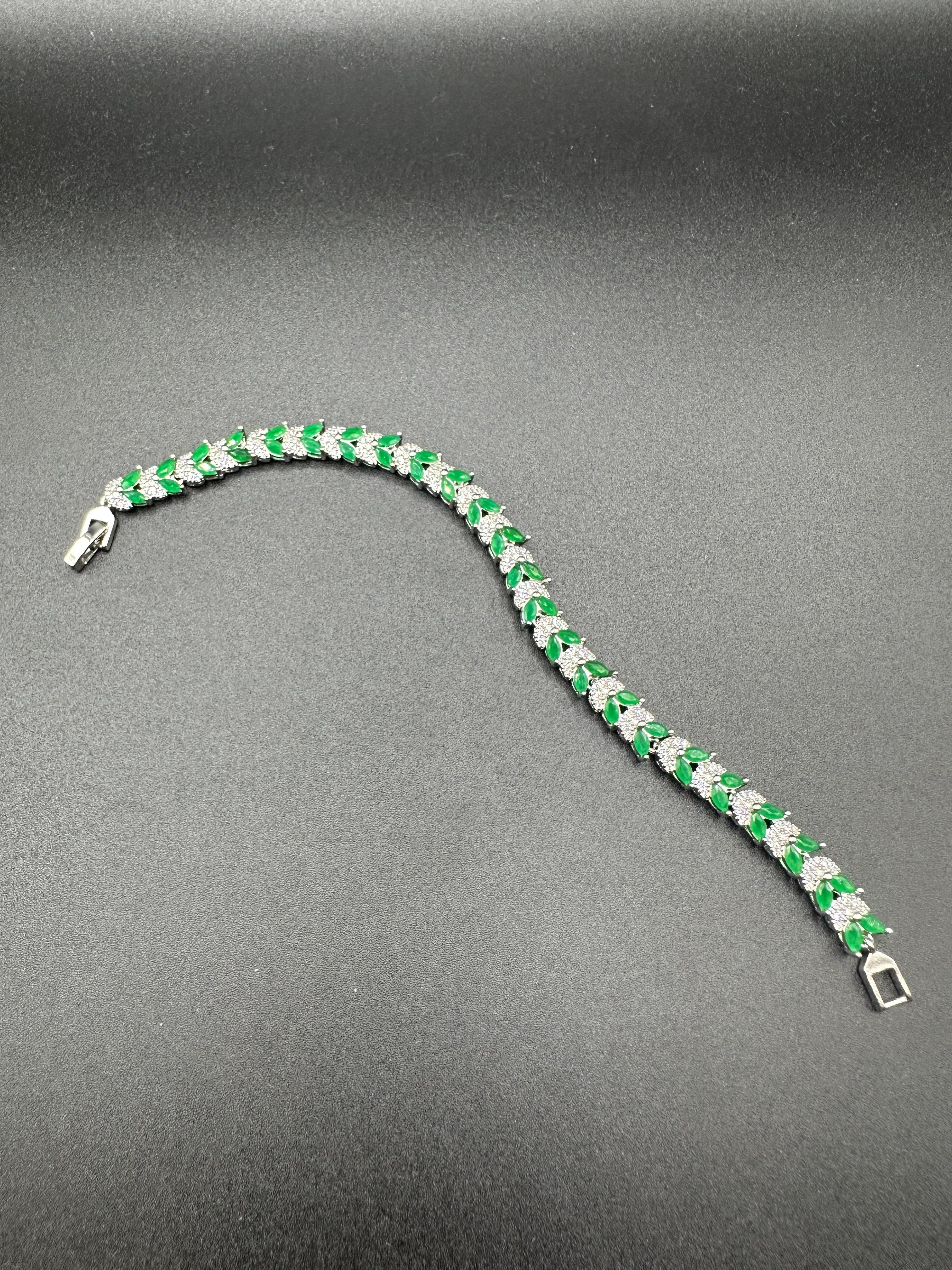 Emerald and zircon bracelet with silver base