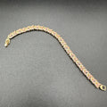 Zircon and light pink stones bracelet with golden base