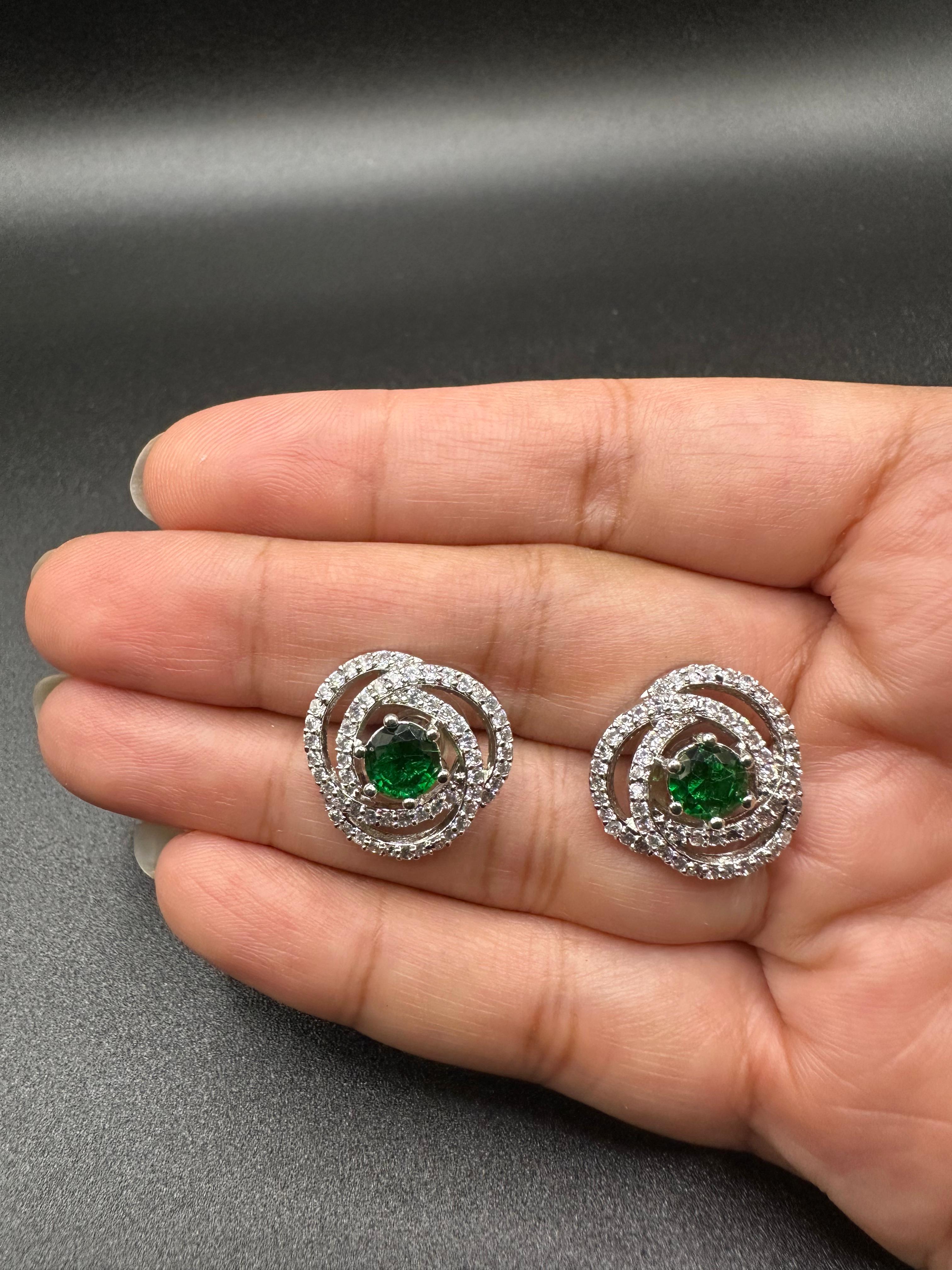Classic zircon studs with emerald inside