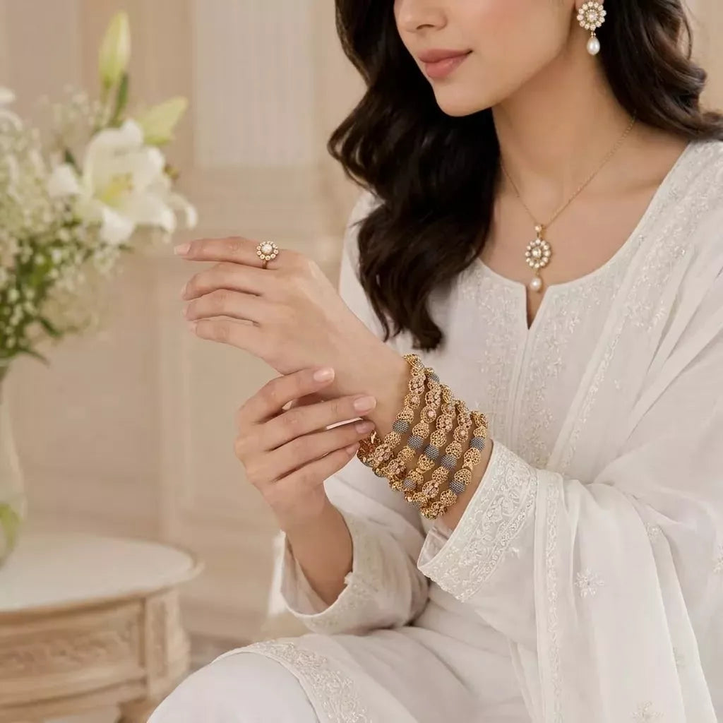Golden bangles with champagne stones(set of 6)