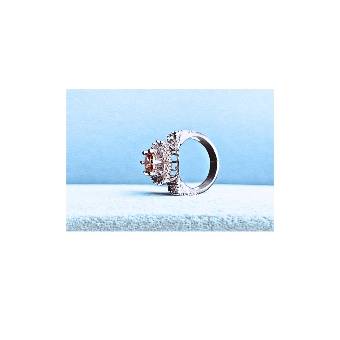 Champagne solitaire ring with zircons in silver frame