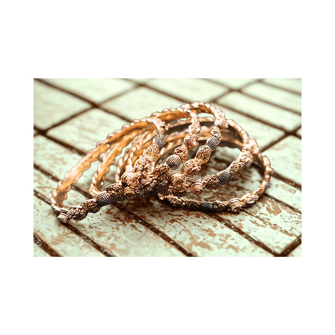 Golden bangles with champagne stones(set of 6)