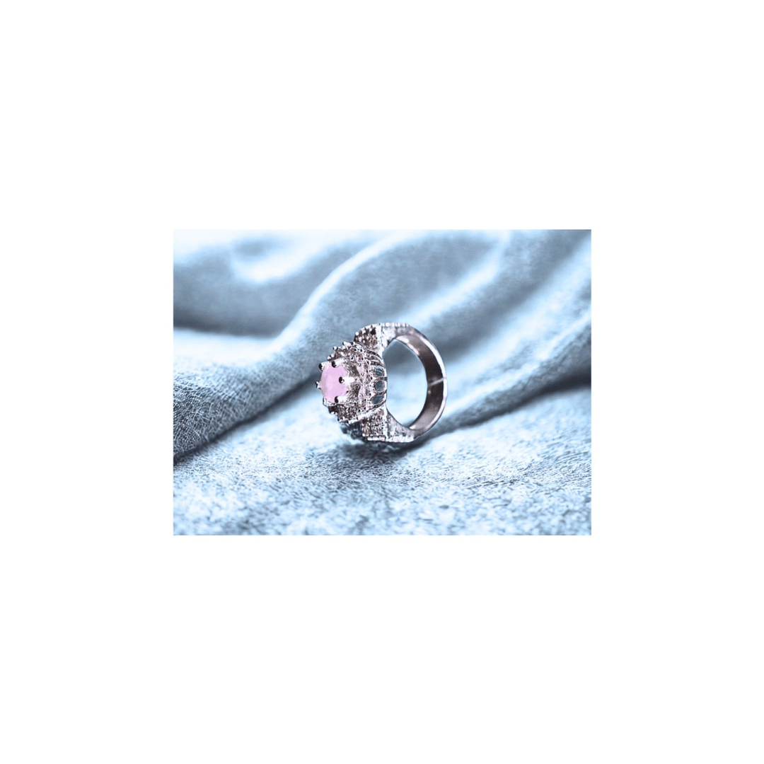 Pink solitaire ring with zircons in silver frame