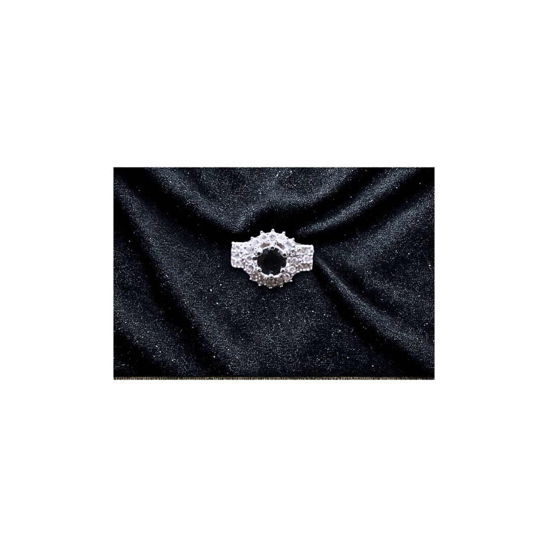black solitaire ring with zircons in silver frame