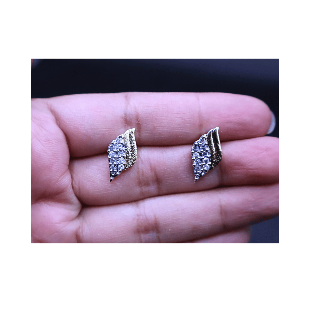 Golden studs with zircon