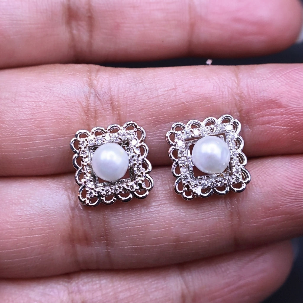 Square shaped studs with pearl in center