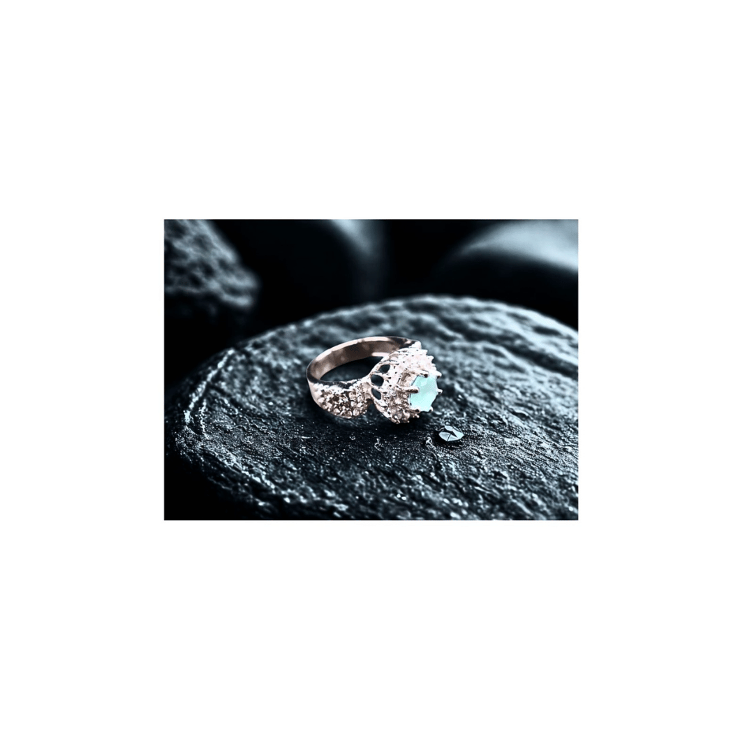 Turquoise solitaire ring with zircons in silver frame