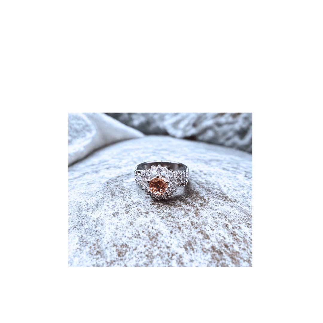 Champagne solitaire ring with zircons in silver frame