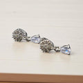 Dangle style silver earrings with zircon