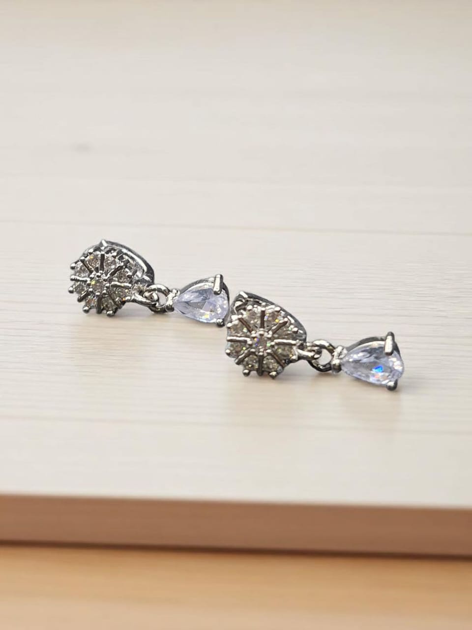 Dangle style silver earrings with zircon