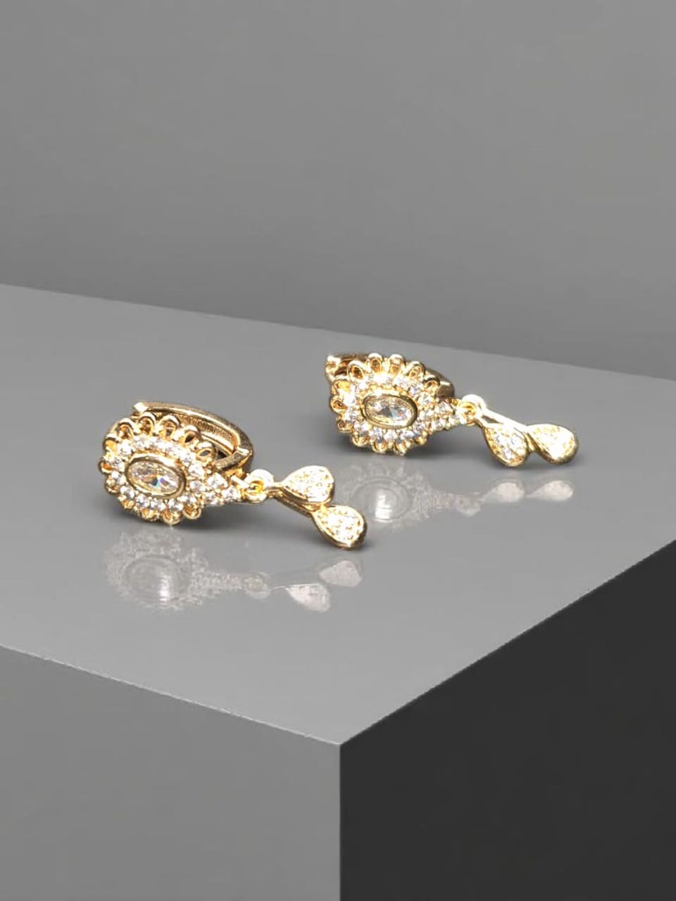 Gold plated earrings with white stone