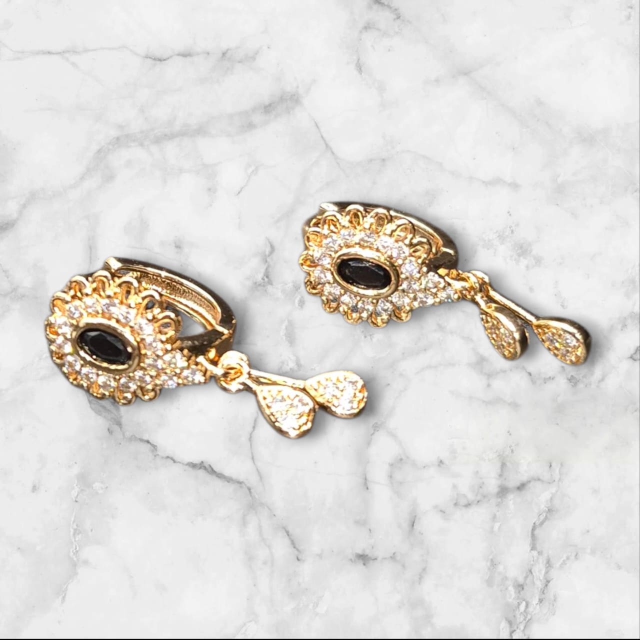 Gold plated earrings with black stone