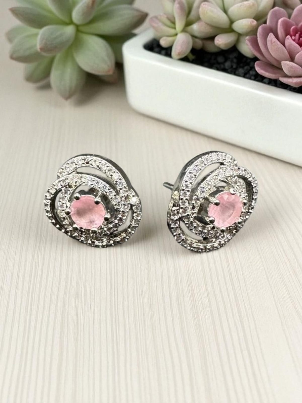classic zircon studs with pink stone inside