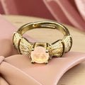golden adjustable ring with pink stone