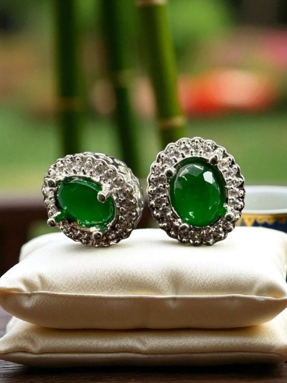 Zircon studs with emerald