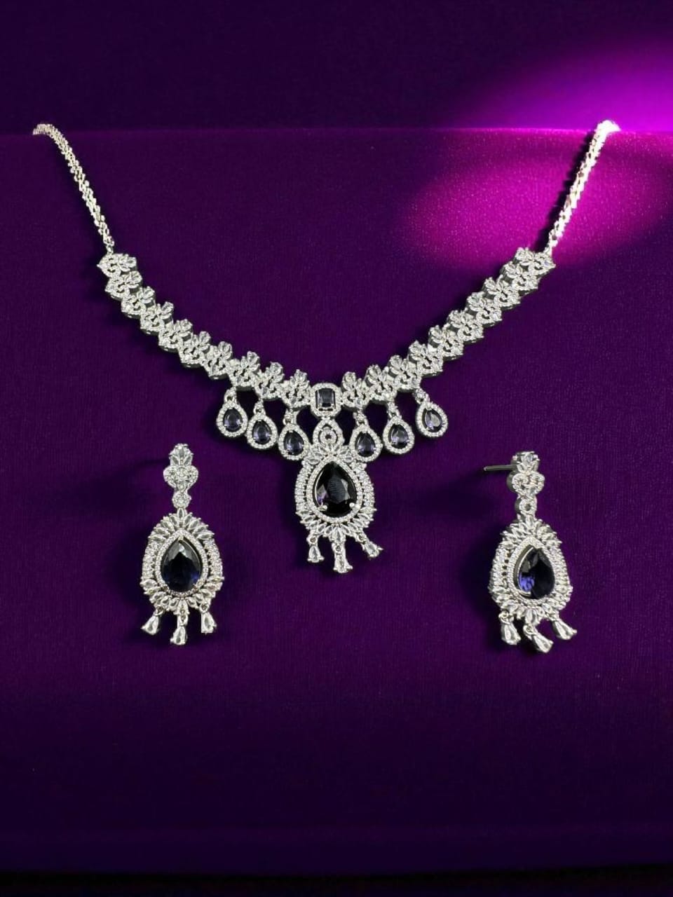 Silver plated zircon set with sapphire
