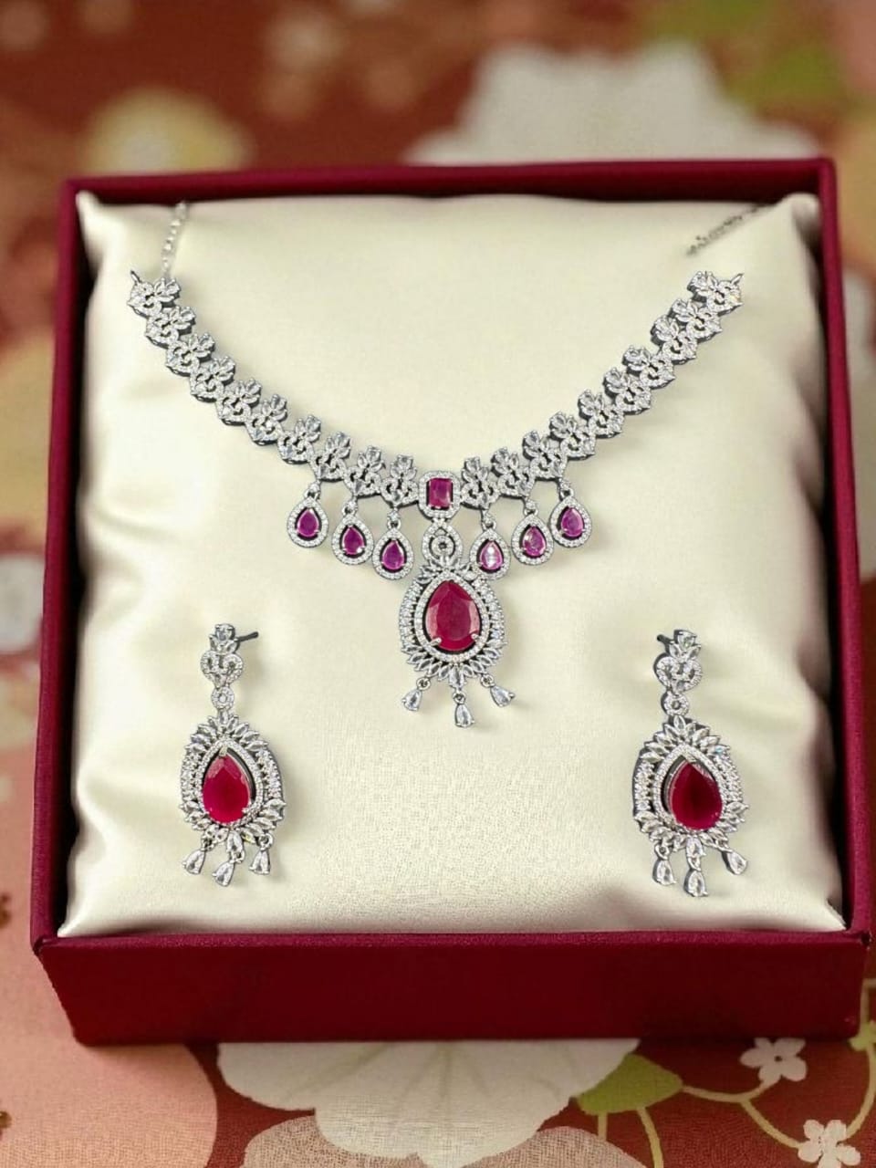 Silver plated zircon set with ruby