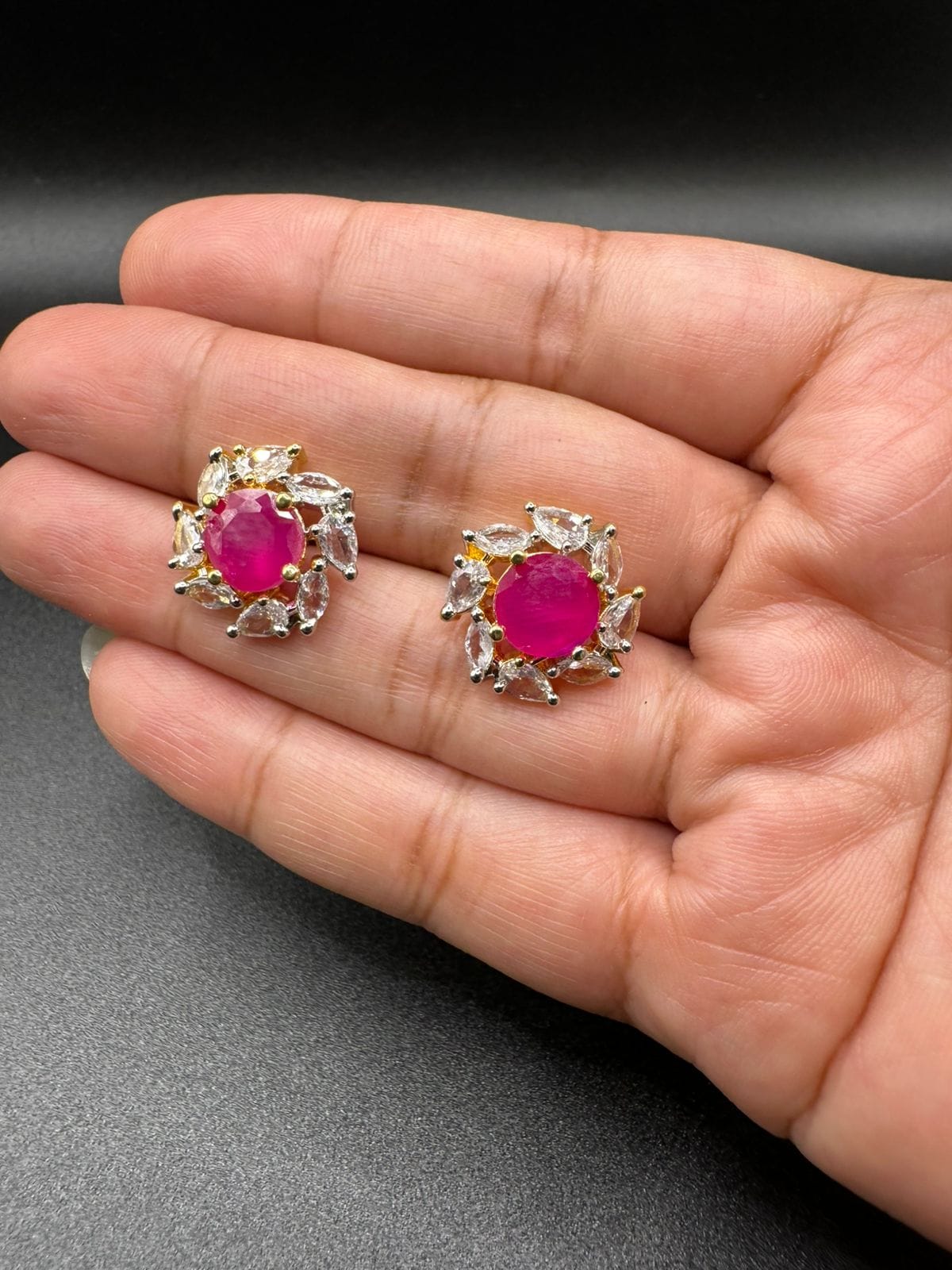 Zircon studs with ruby in gold base