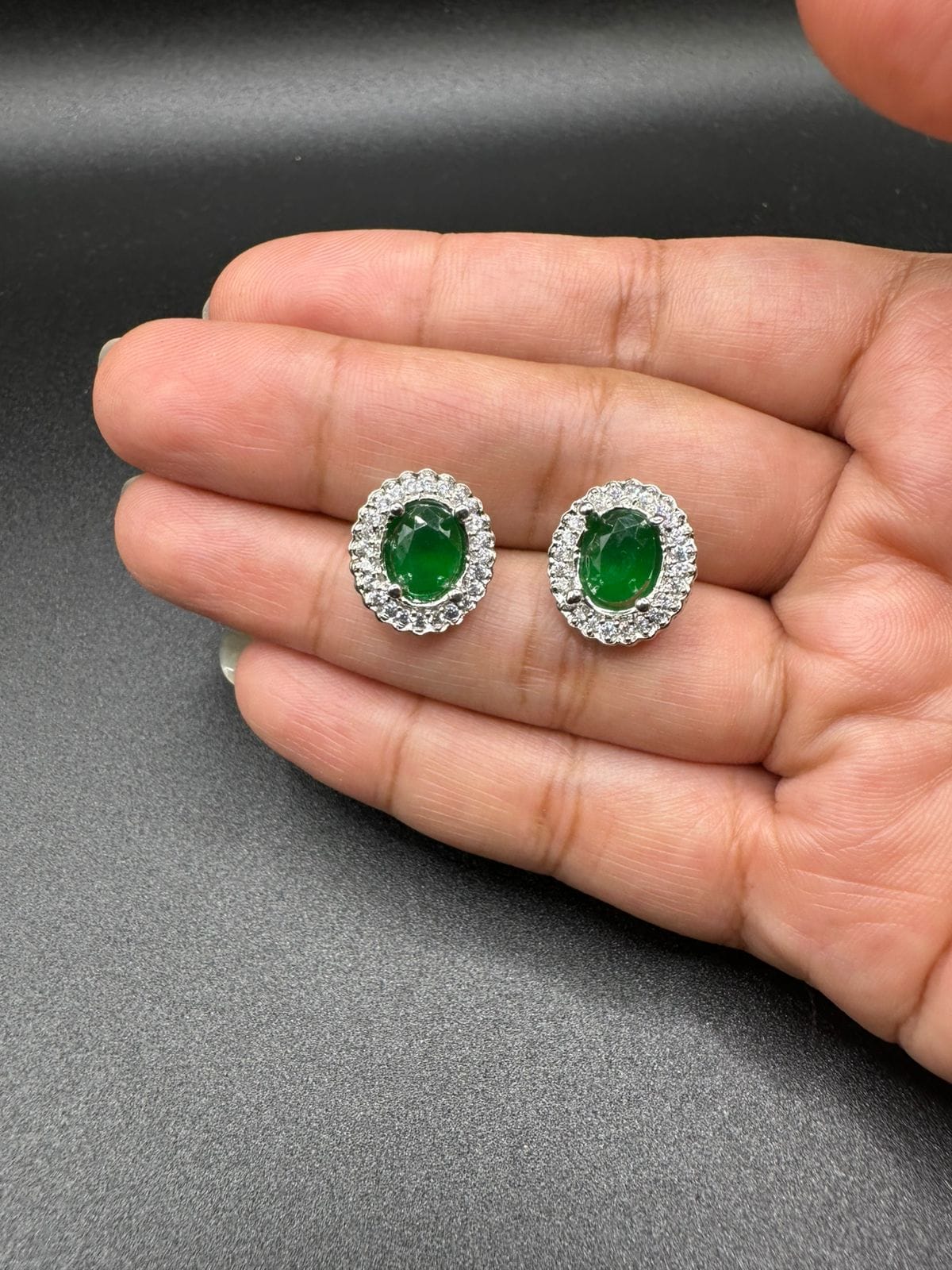 Zircon studs with emerald