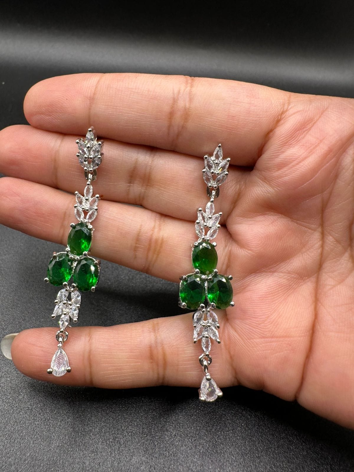 Silver plated zircon set with emerald