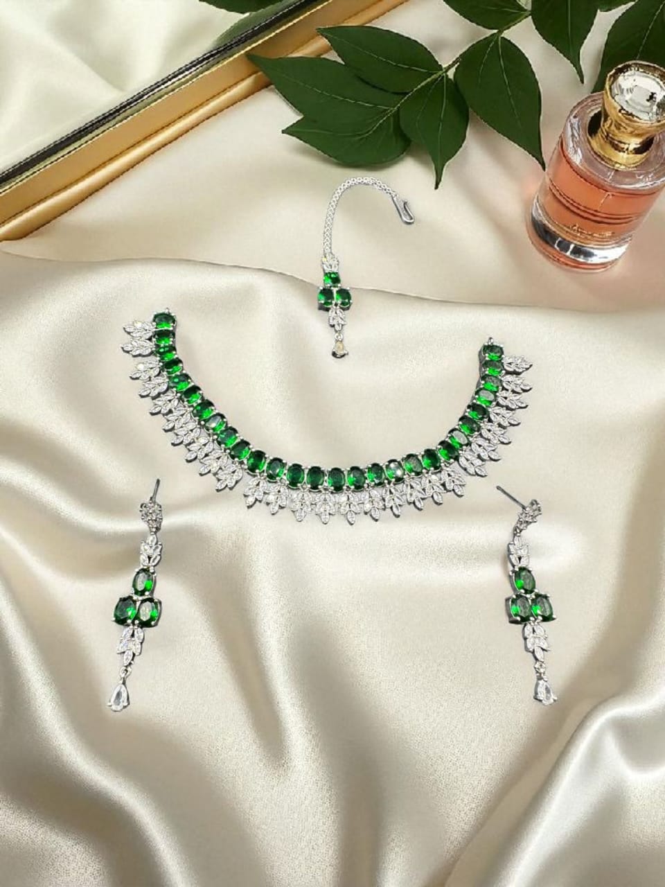 Silver plated zircon set with emerald