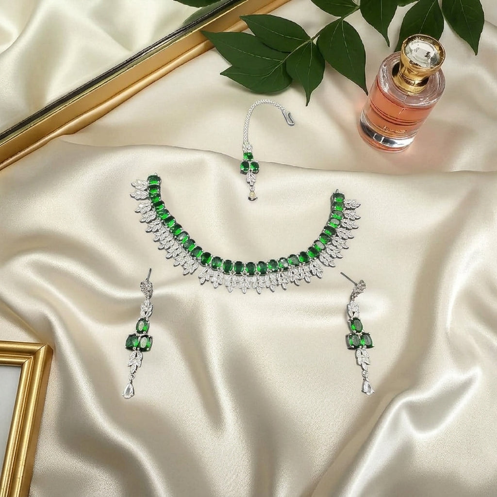 Silver plated zircon set with emerald