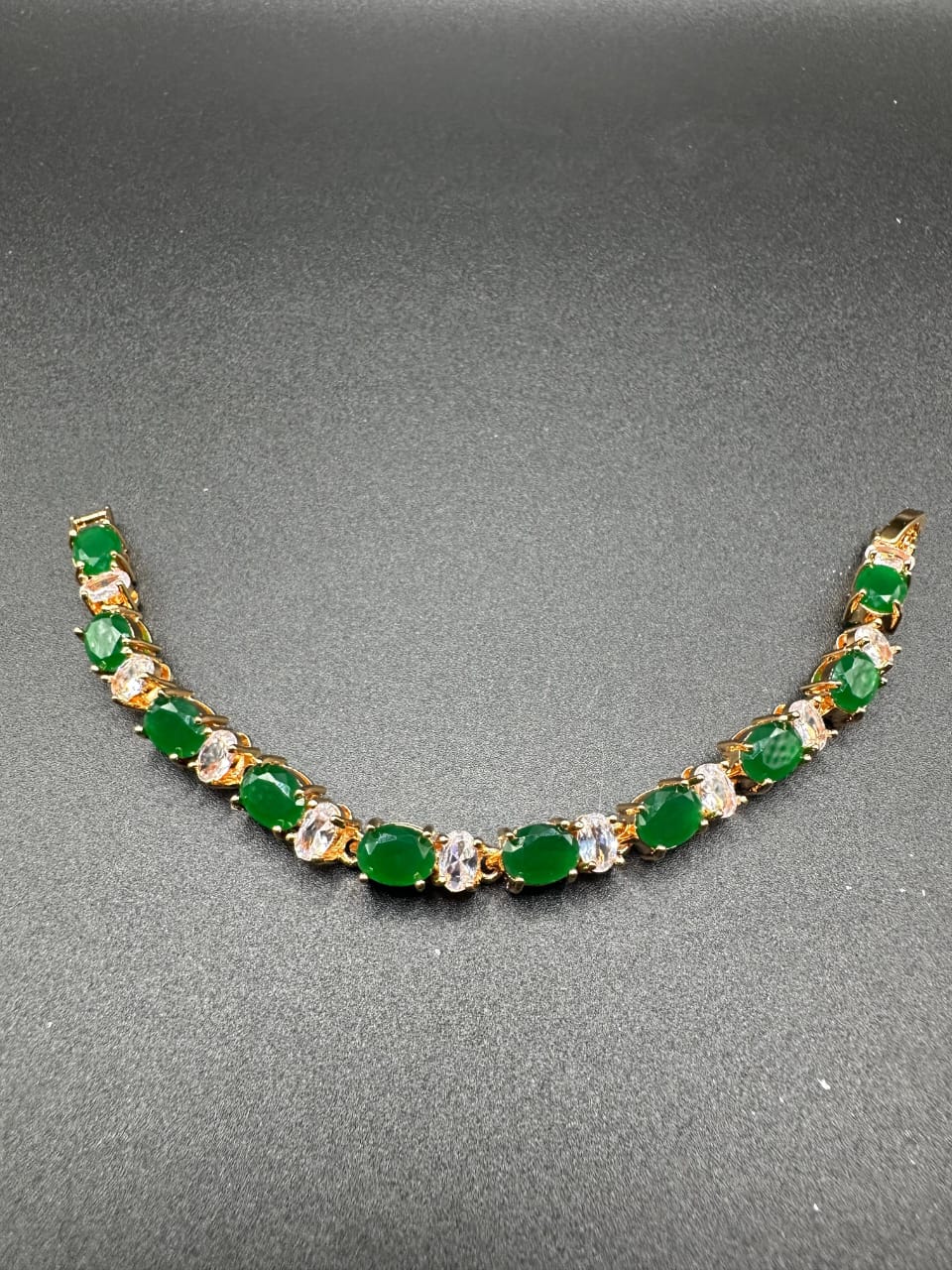 Emerald bracelet with golden base for girls