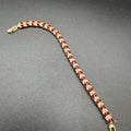 Ruby and zircon bracelet with golden base